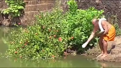 The crocodile at Ananthapura Lake Temple lies in front of the sanctum sanctorum