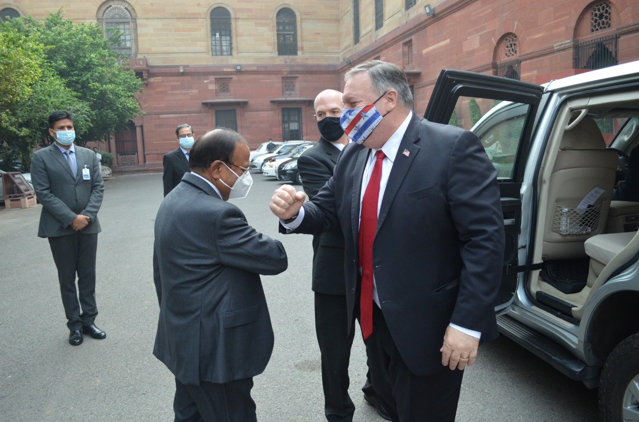 Doval greeting Pompeo