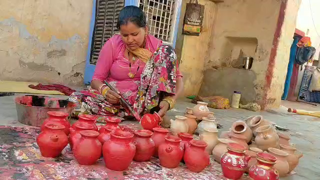 A woman making pottery