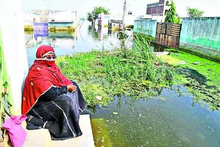 Worse conditions filled with flood water in Usman Nagar