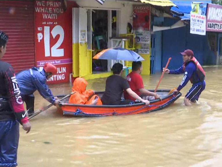 39 dead after typhoon leaves high water, mud in Philippines