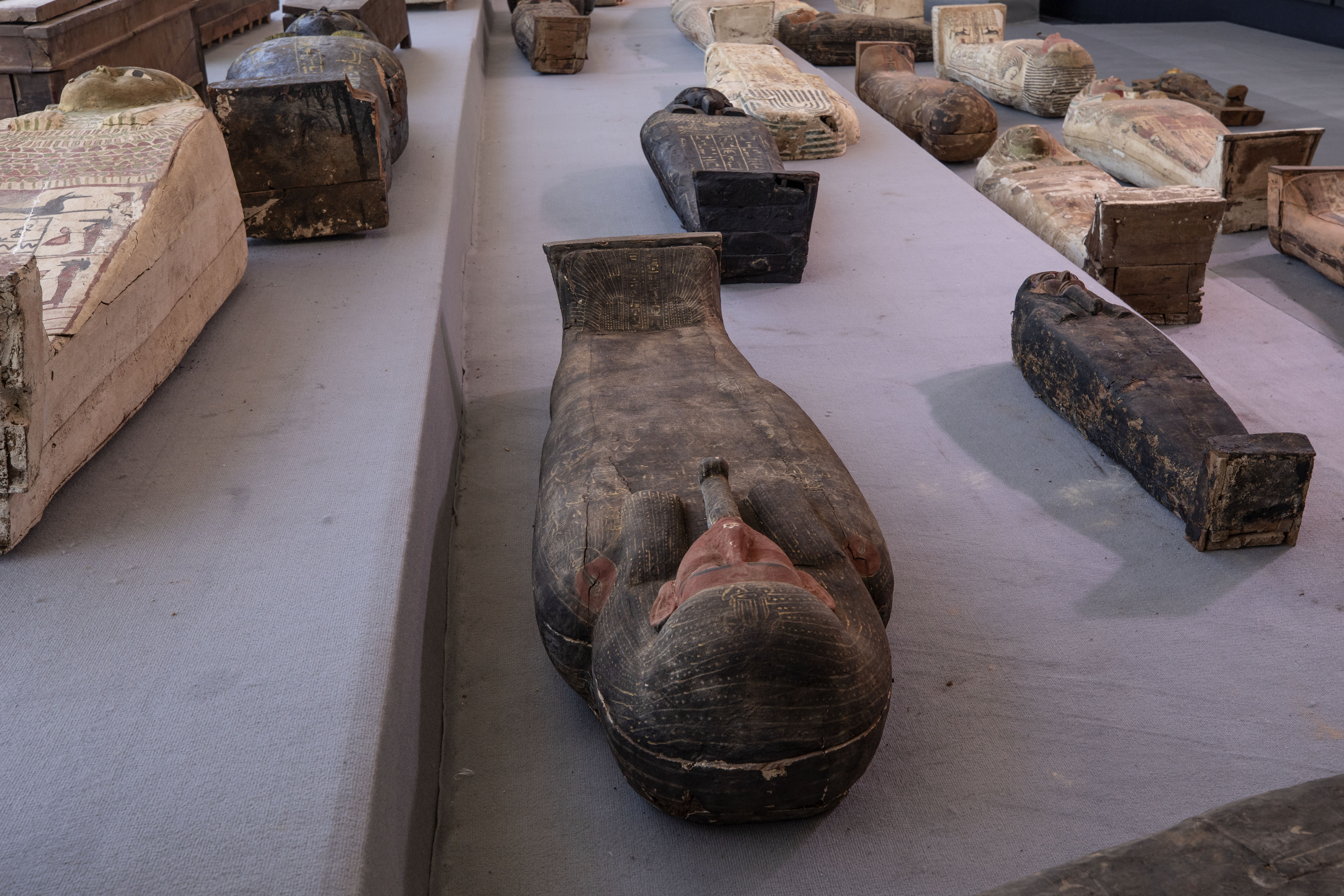 Egypt unveils ancient coffins, statues found in Saqqara