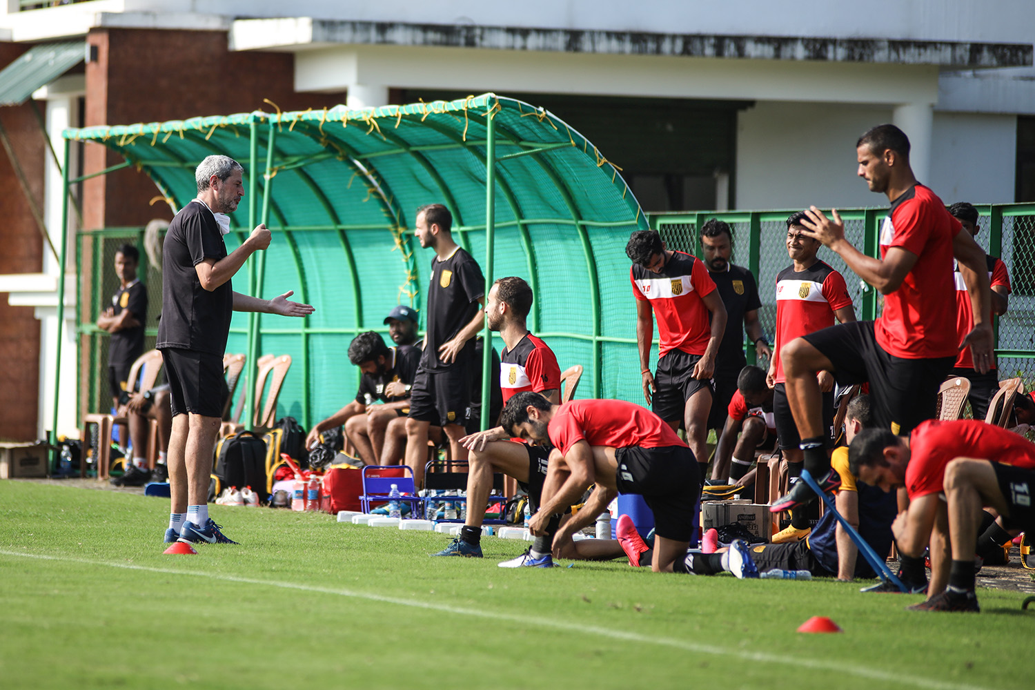 Head coach Manuel Marquez passing tips to Hyderabad FC players during a pre-season match.