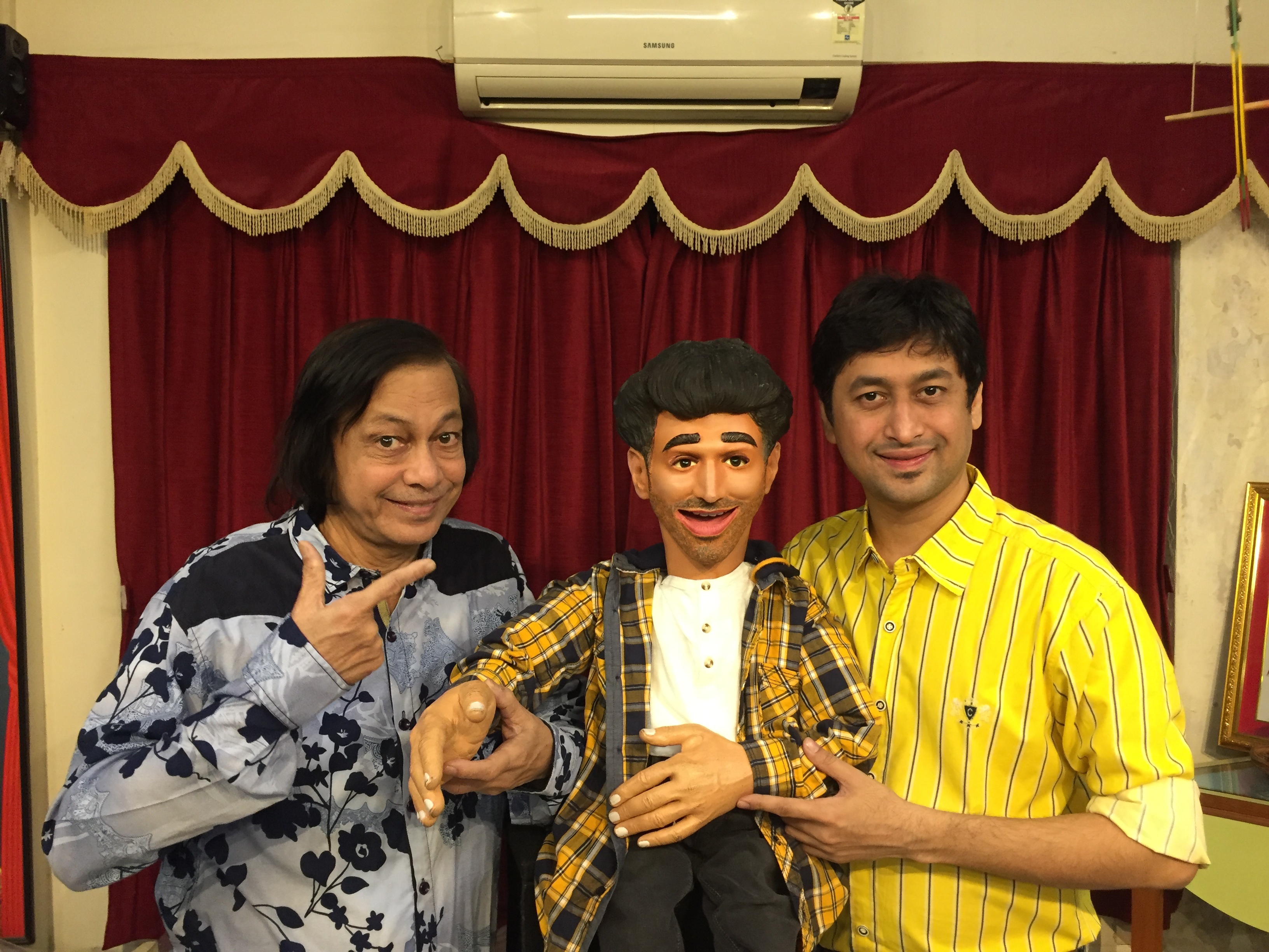 Satyajit and Ramdas Padhye with Aditya's doll