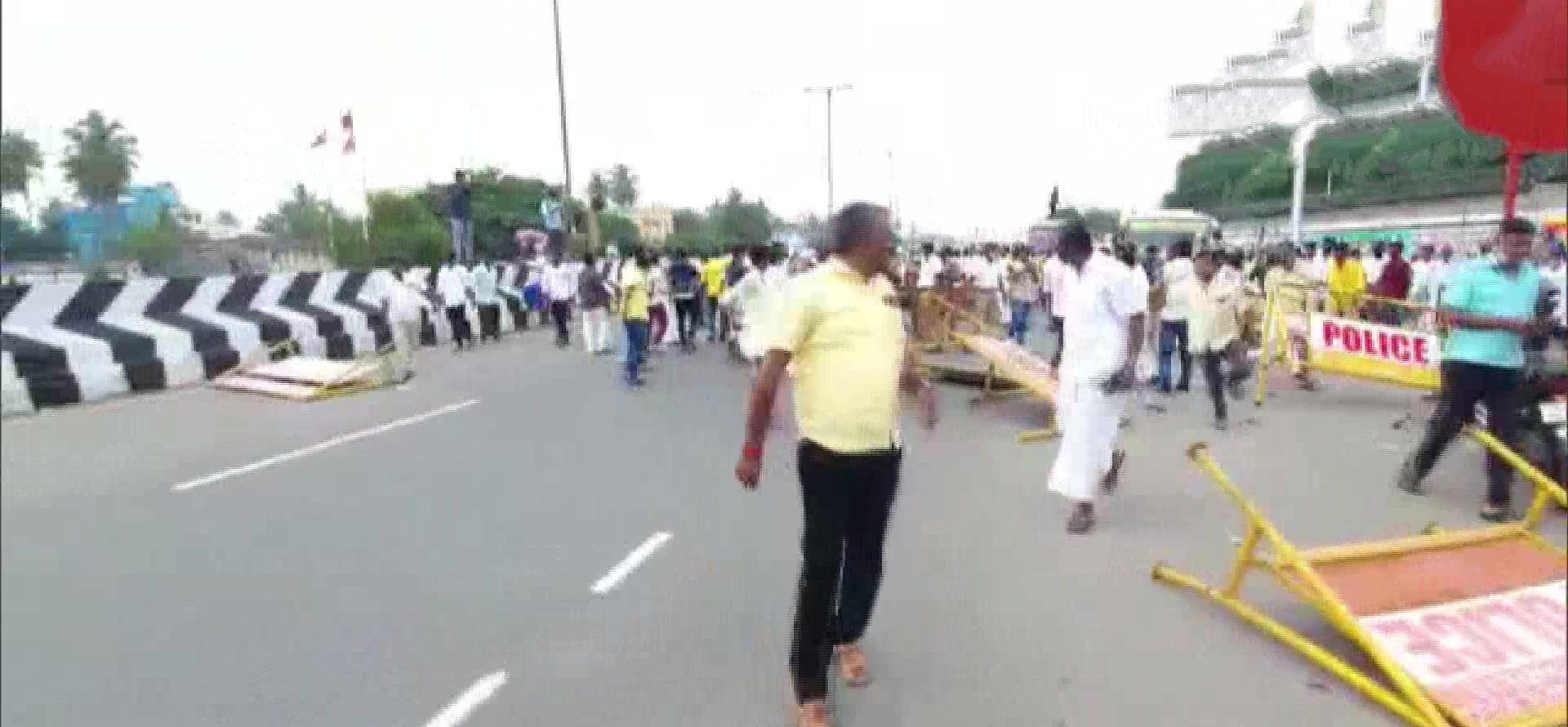 Paattali Makkal Katchi workers pelt stones at a train and block road in Perungalathur after being stopped by police