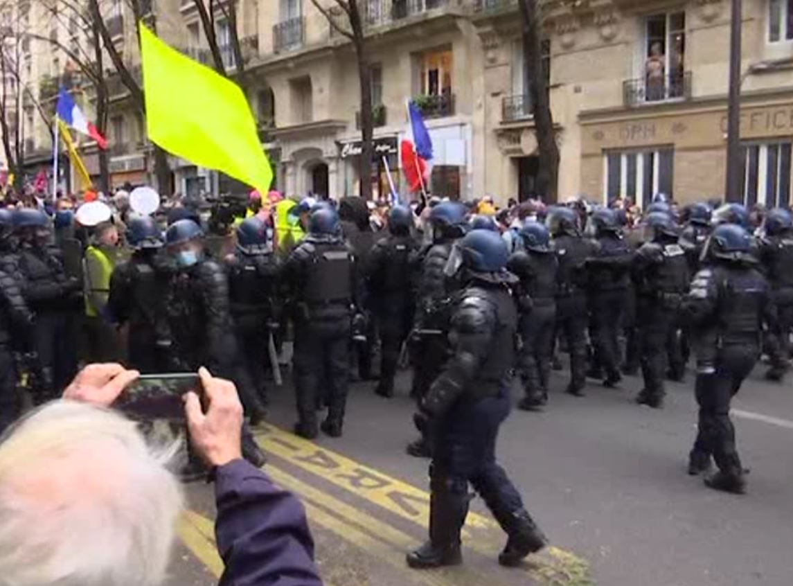 Fires could be seen on the streets in Paris on Saturday as thousands protested