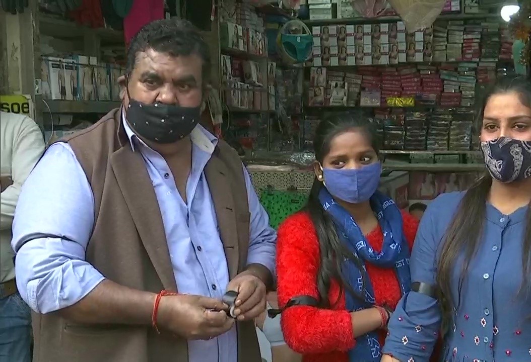 Shopkeepers in Sarojini tie black ribbons around their arms