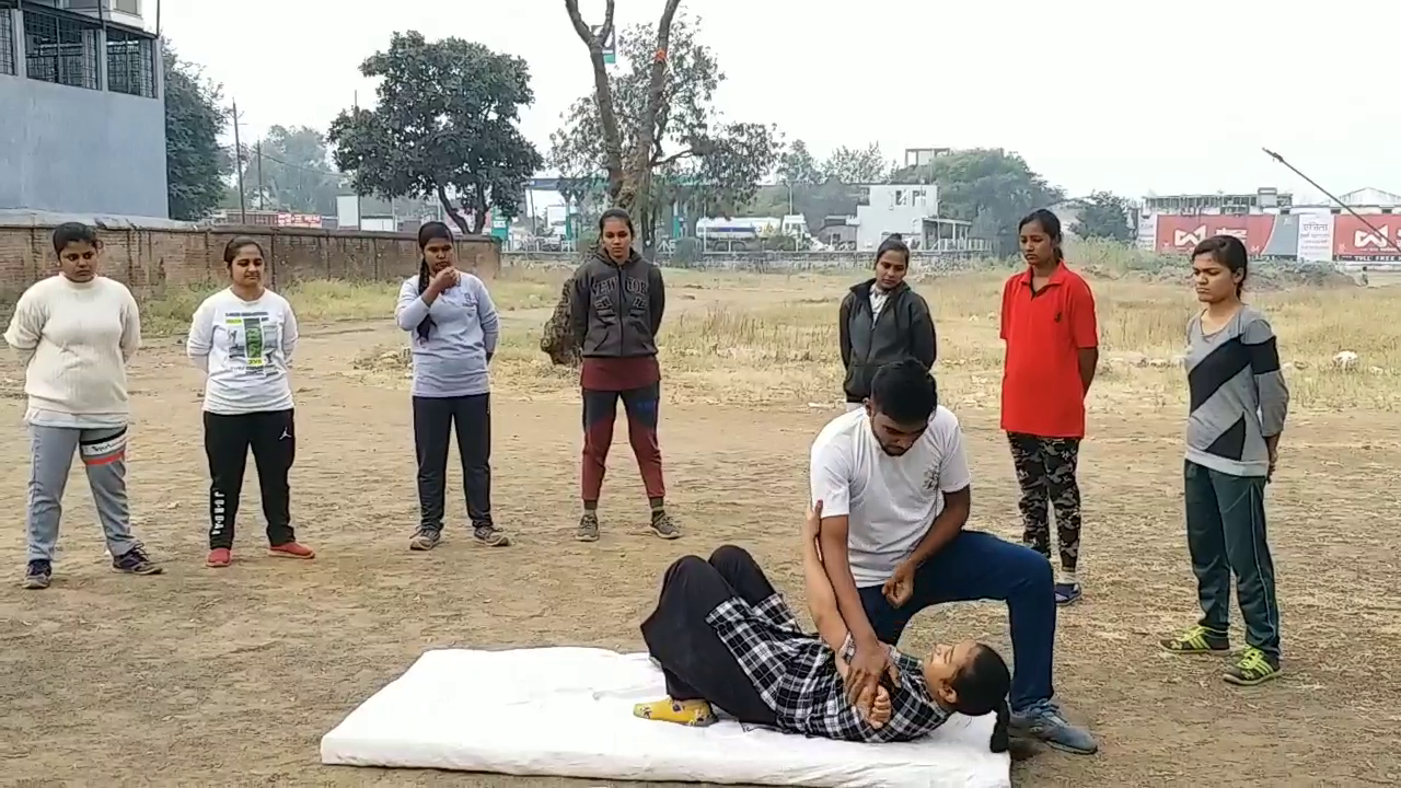 Girls taking self defense training