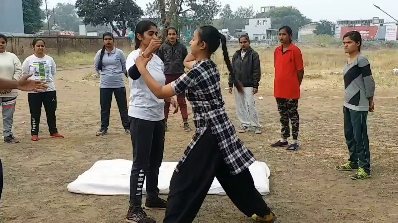 Girls taking self defense training