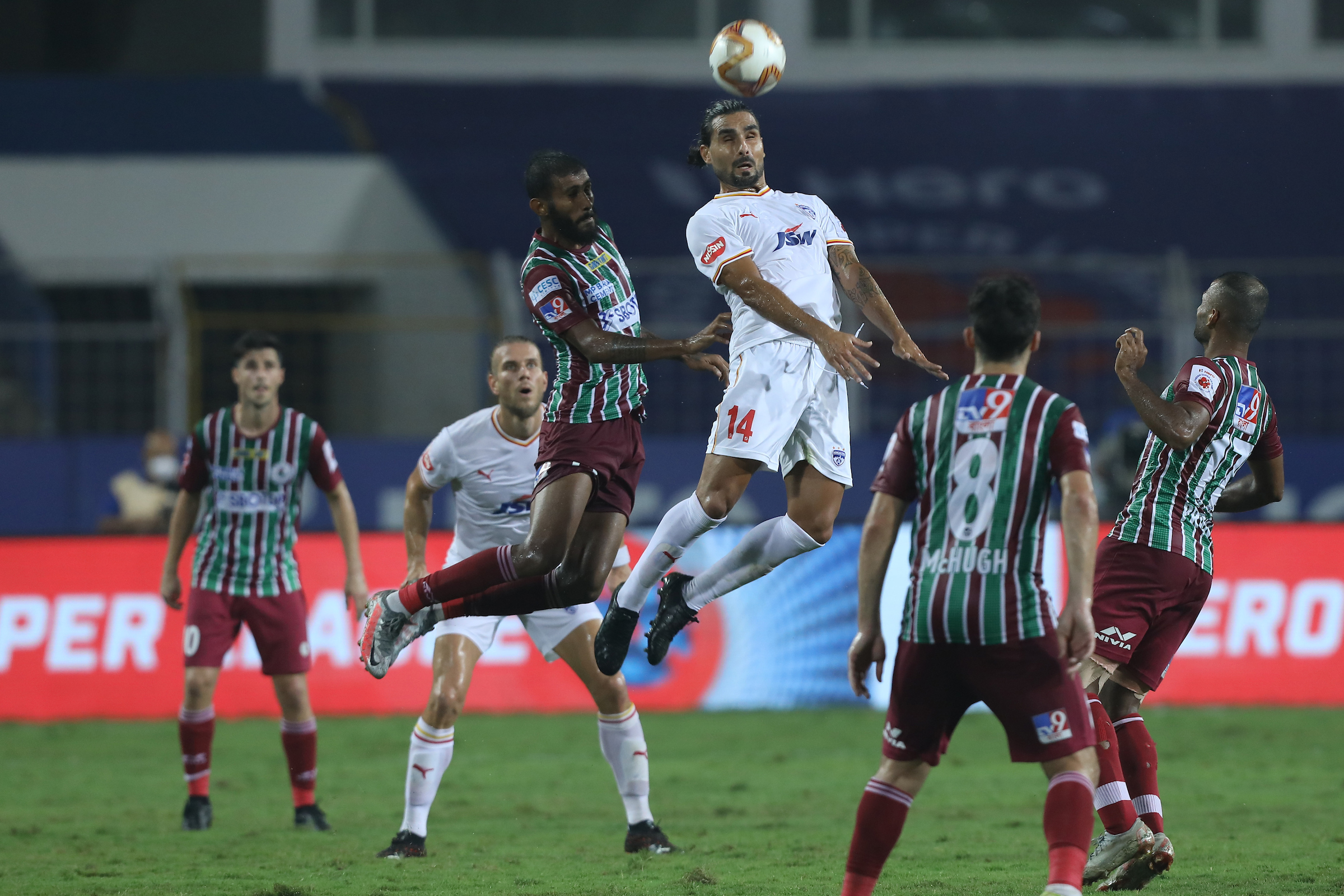 Bengaluru FC's Dimas Delgado and ATKMB's Subhasish Bose jump for an aerial ball during match 36 of Hero ISL 7 at the JL Nehru Stadium in Fatorda today. (ISL)