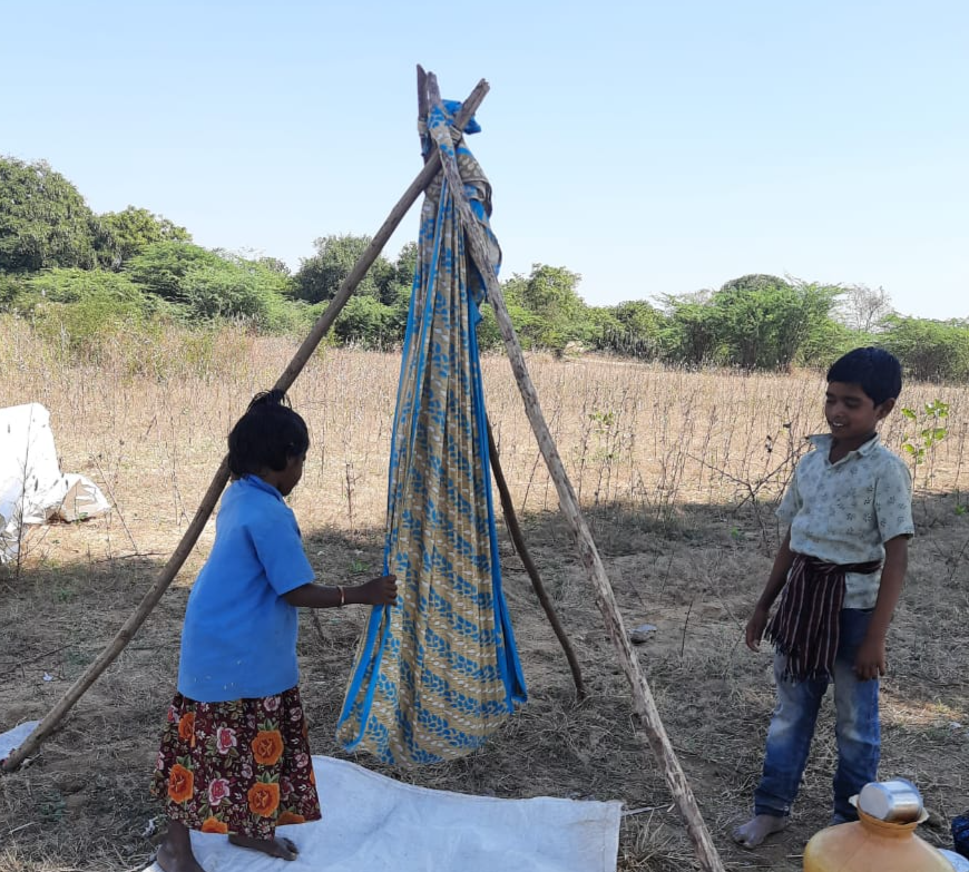 three-months-baby-in-crops-while-mother-doing-labor-work-in-fields-at-thungathurthy-in-suryapet