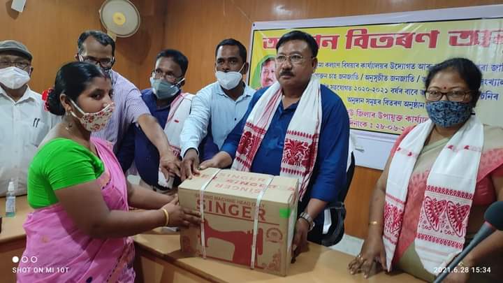 Minister of Disaster management Jogen Mohan giving compensation At Dibrugarh