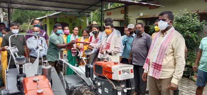 Minister Rameshwar Teli distributes power tiller and loom