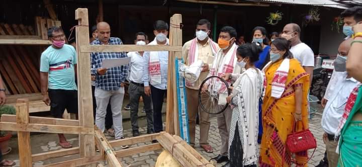 Minister Rameshwar Teli distributes power tiller and loom