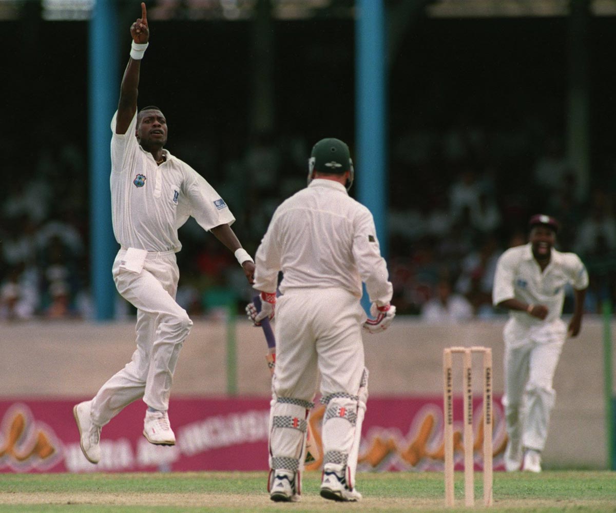 Steve Waugh looks on as Ambrose celebrates.