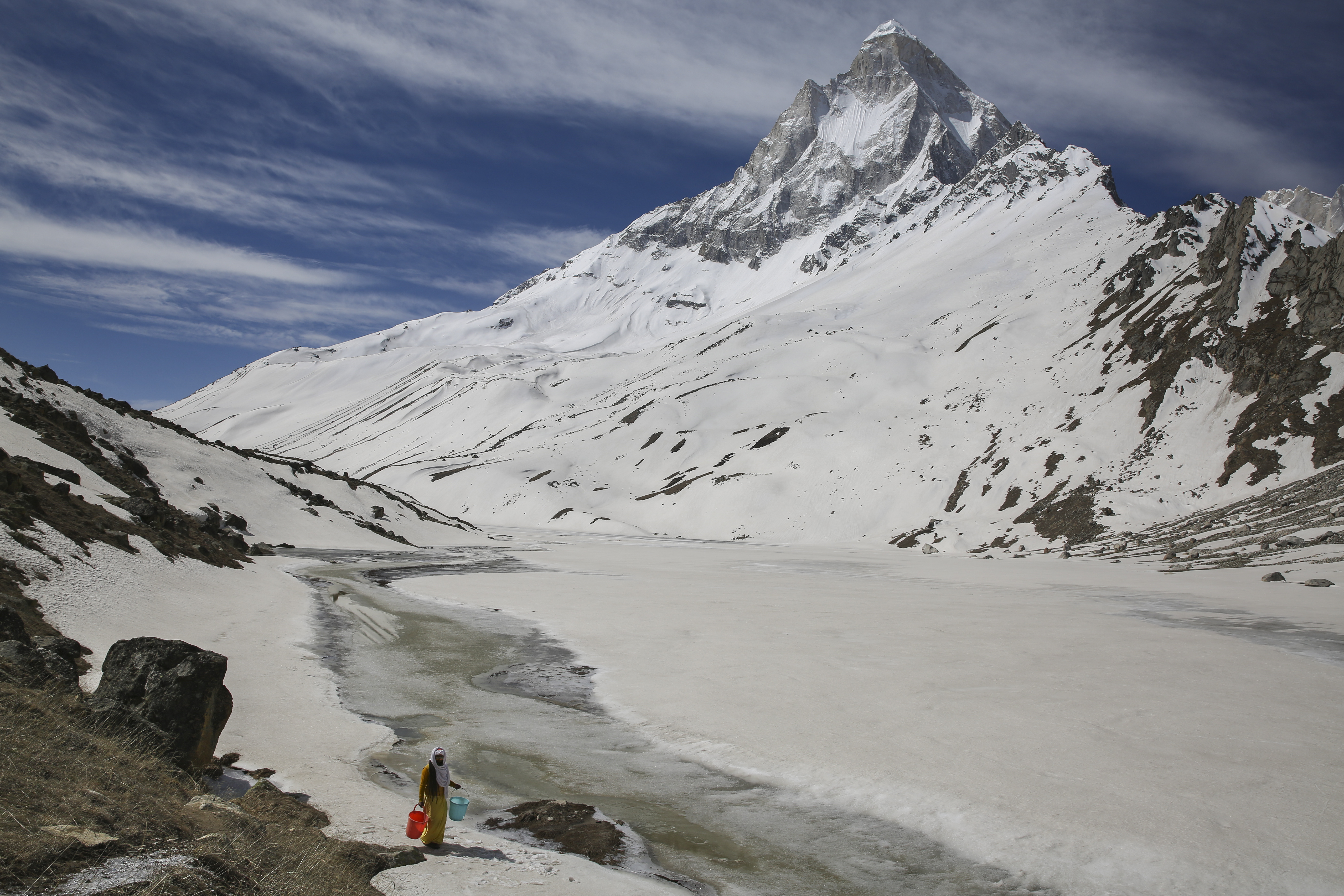 Mouni Baba, a Hindu holy man, fetches water from a stream at the feet of Mount Shivling in Tapovan, at an altitude of 4,500 meters in Uttarakhand. Mouni Baba, on a silent vow, has been meditating in Tapovan for years, even during the long months when winter makes the place inaccessible. Tapovan is located just above Gangotri glacier, which is one of the primary sources of water for the Ganges.