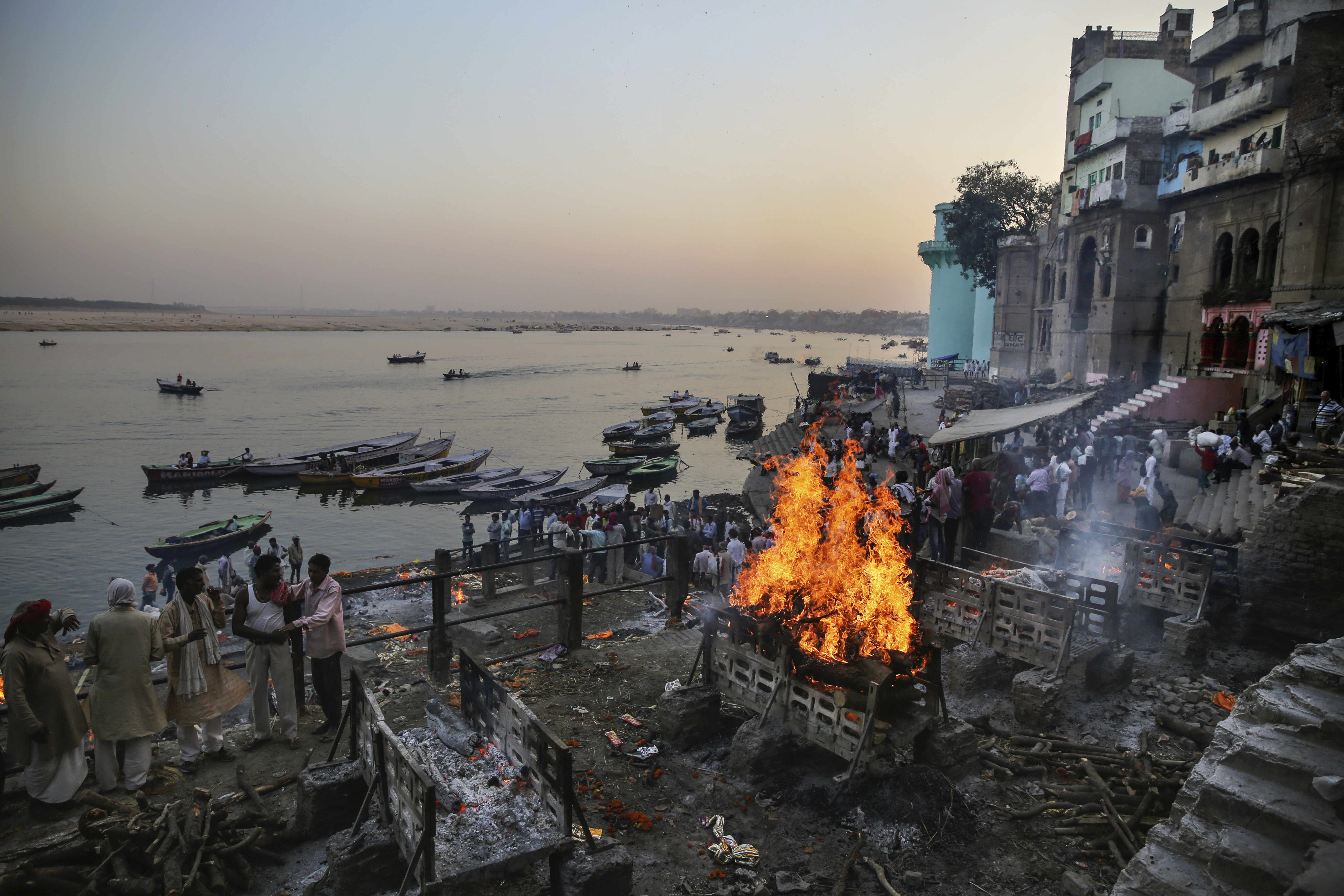 Funeral pyres burn at Manikarnika Ghat, one of the oldest and most sacred place for Hindus to be cremated, on the banks of river Ganges in Varanasi.