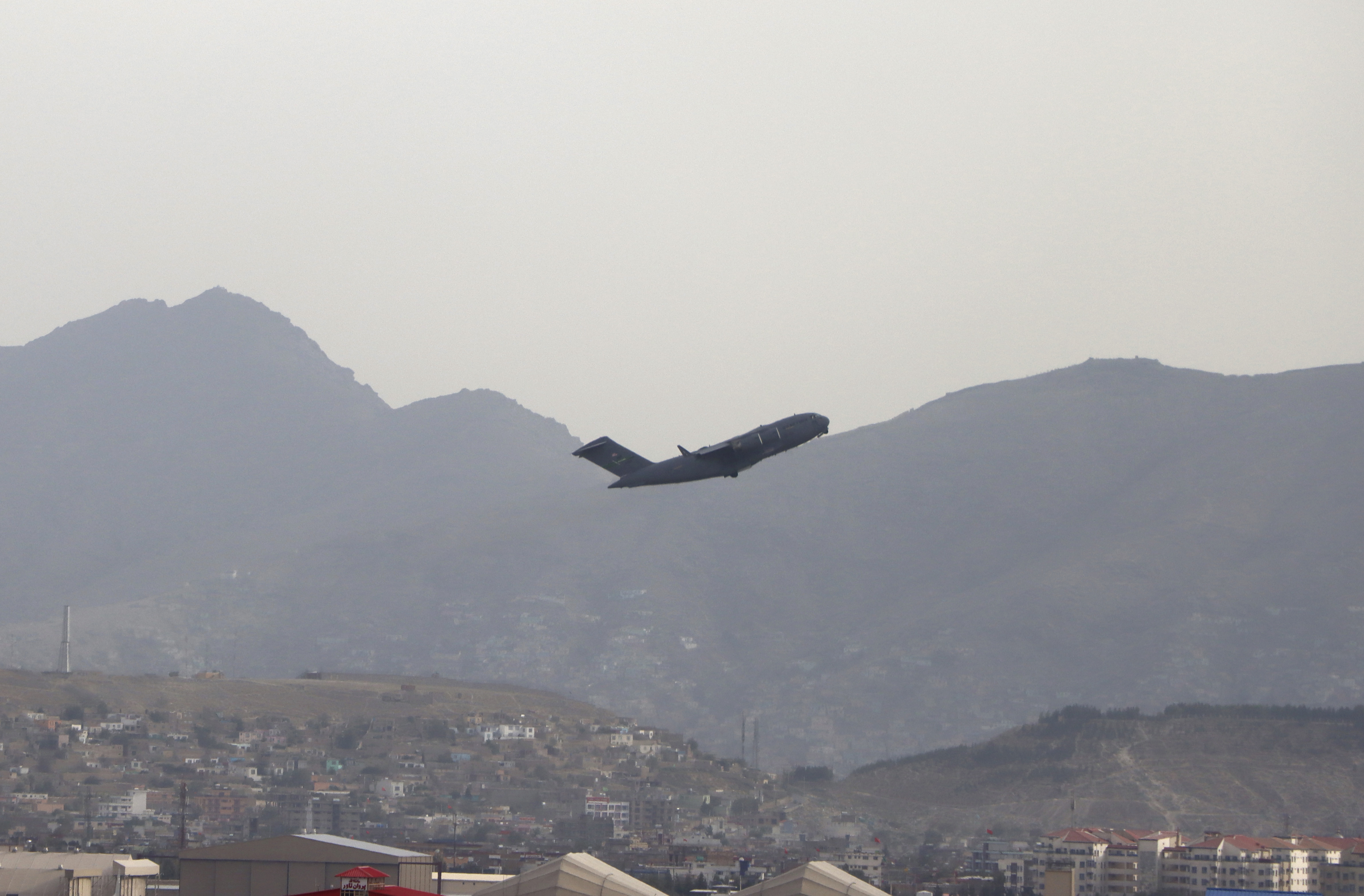 A U.S military aircraft takes off from the Hamid Karzai International Airport in Kabul, Afghanistan, Monday.