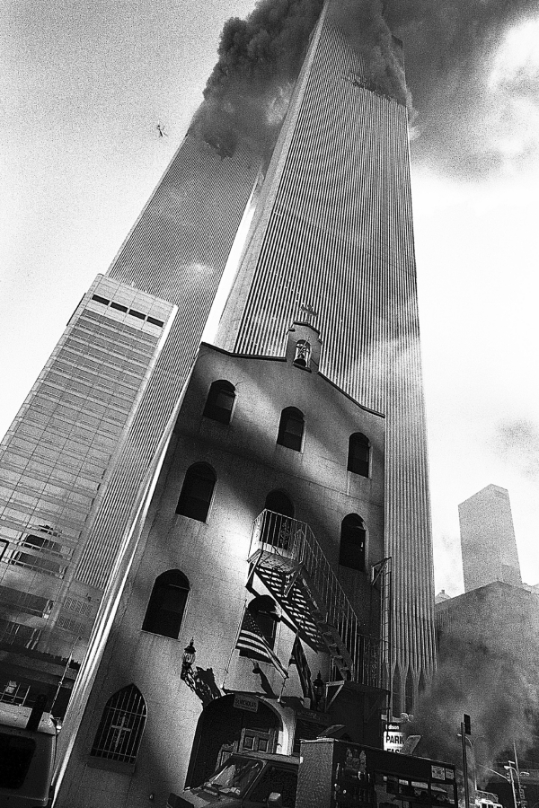 In this Sept. 11, 2001, photo provided by the Greek Orthodox Archdiocese of America, smoke billows from the World Trade Center towers as St. Nicholas Greek Orthodox Church sits below them in New York's financial district. St. Nicholas was the only house of worship destroyed in the Sept. 11, 2001 attacks.