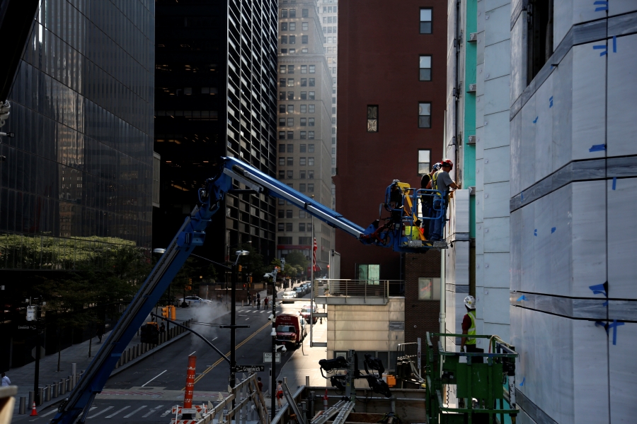 Workers install marble on the exterior of St. Nicholas Greek Orthodox Church and National Shrine on Friday, Aug. 27, 2021, in New York. The shrine will have a ceremonial lighting on the eve of the 20th anniversary of the Sept. 11, 2001 attacks, while the interior is slated for completion next year.