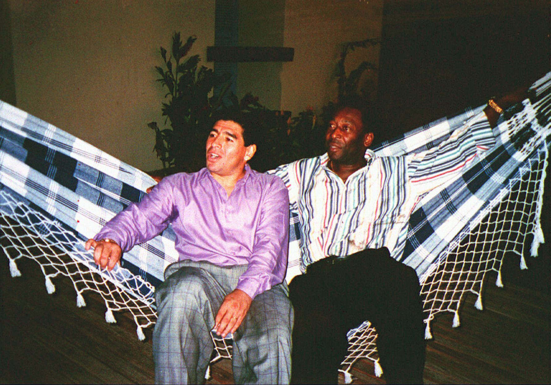 Argentine soccer star Diego Armando Maradona, left, rests in a hammock with Brazilian soccer star Pele, during a meeting in Rio de Janeiro, Brazil, May 13, 1995.