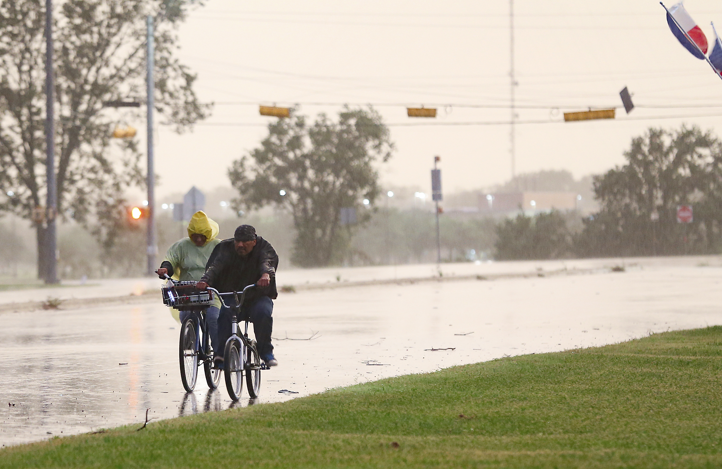 Cyclist make their way down a street in Bay City, Texas
