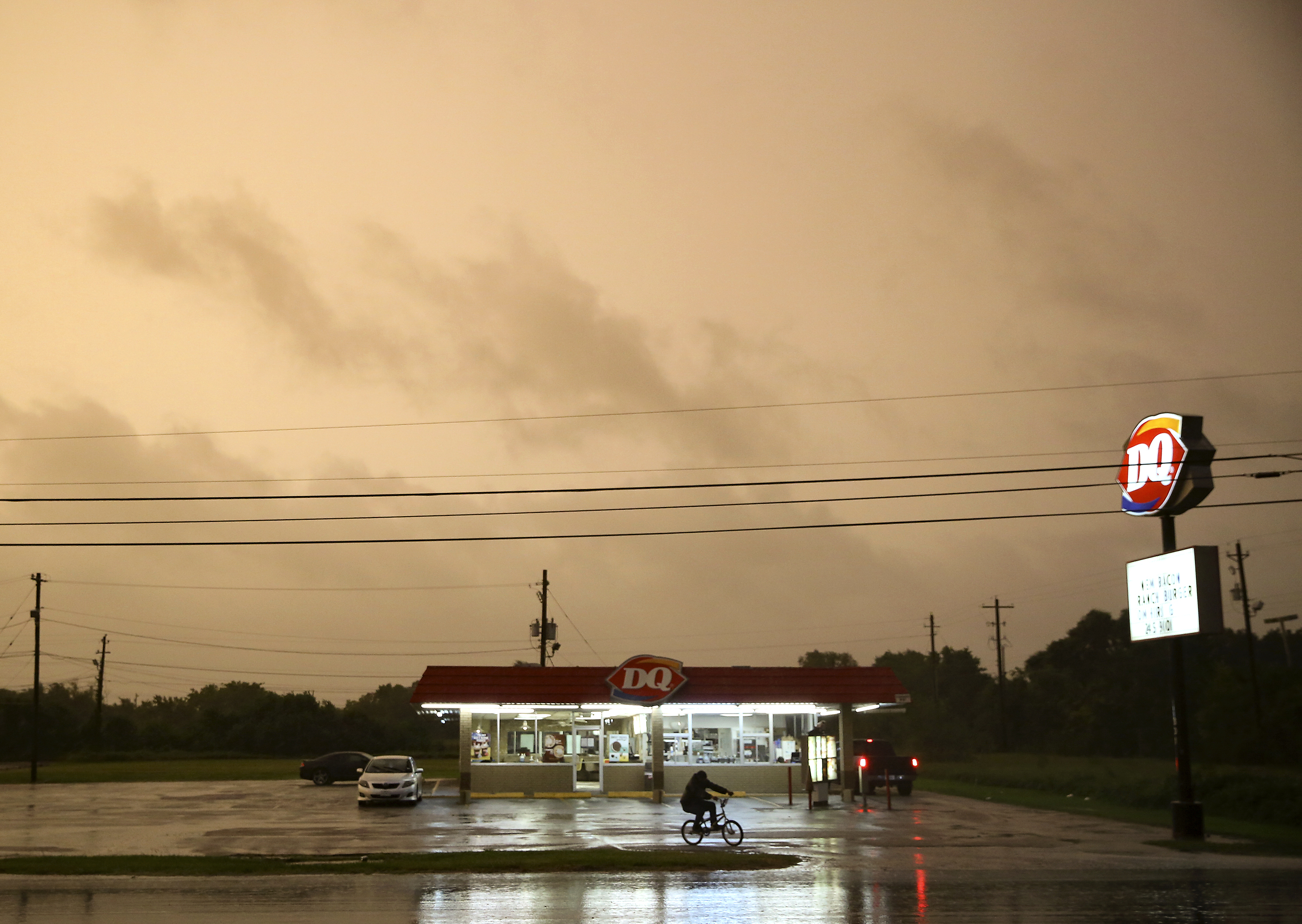 A Dairy Queen in Bay City, Texas, stays open as customers try to get in a meal before it closes as Tropical Storm Nicholas approaches