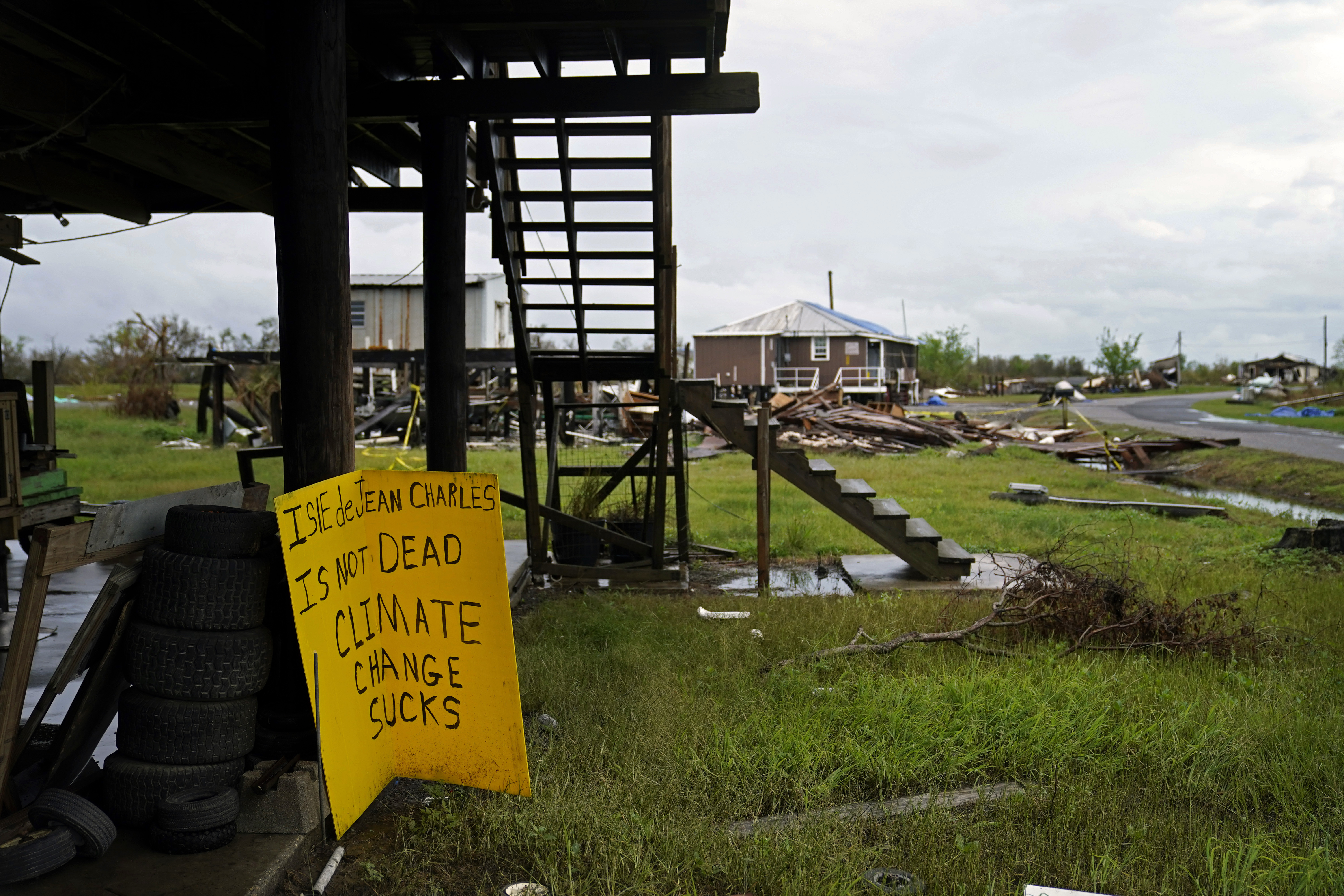 Storm clouds from Tropical Storm Nicholas are seen behind homes of the vanishing Native American community of Isle de Jean Charles