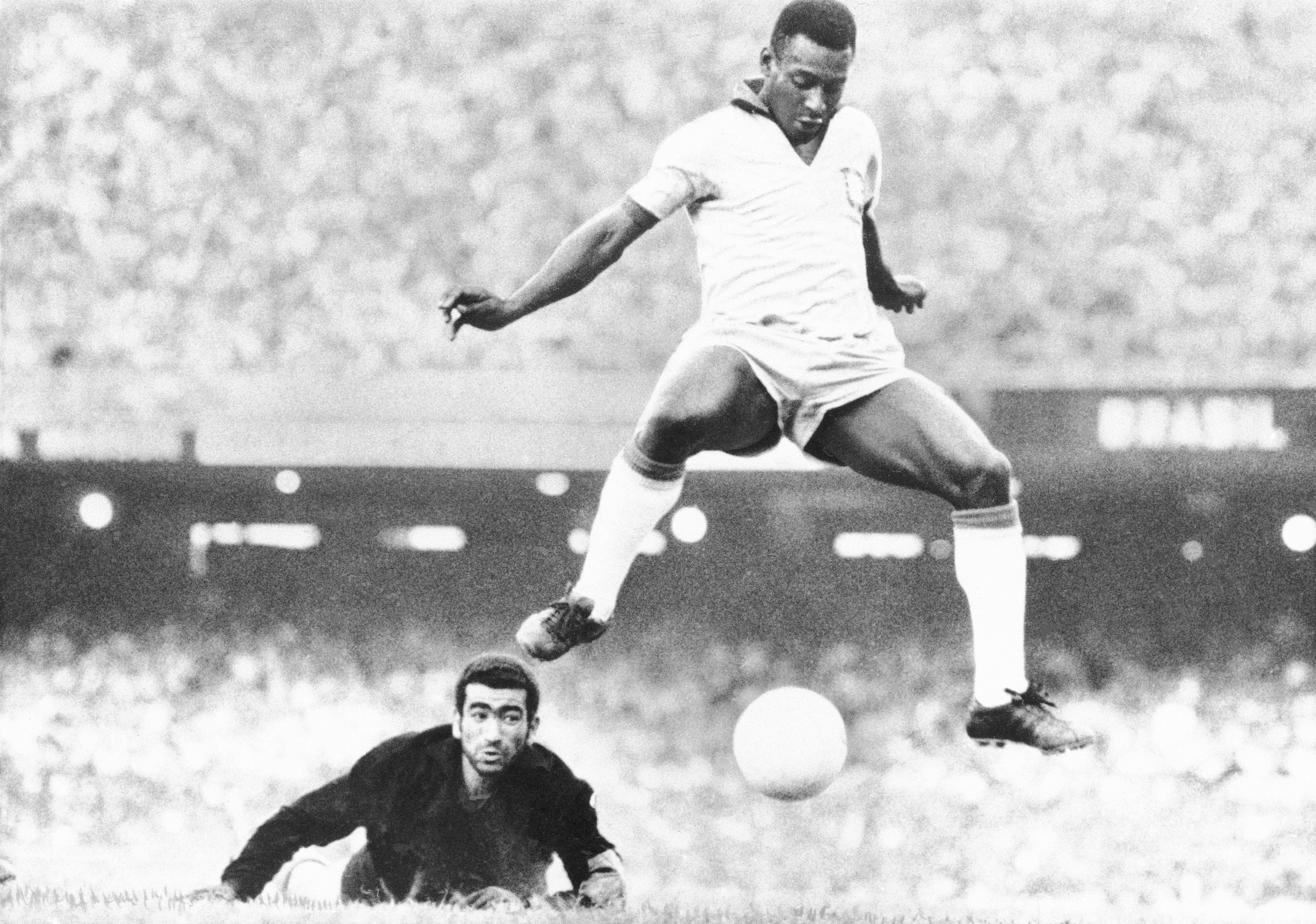 Brazil's Pele scores past Venezuela's goal keeper Fabrizio Fasano in Rio de Janeiro, Brazil, Aug. 24, 1969.