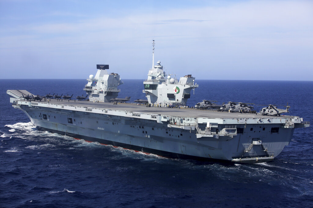 Military personnel participate in a NATO training exercise on board the UK Royal Navy aircraft carrier HMS Queen Elizabeth off the coast of Portugal. With increasingly strong talk in support of Taiwan, a new deal to supply Australia with nuclear submarines, and the launch of a European strategy for greater engagement in the Indo-Pacific, the U.S. and its allies are becoming growingly assertive in their approach toward a rising China