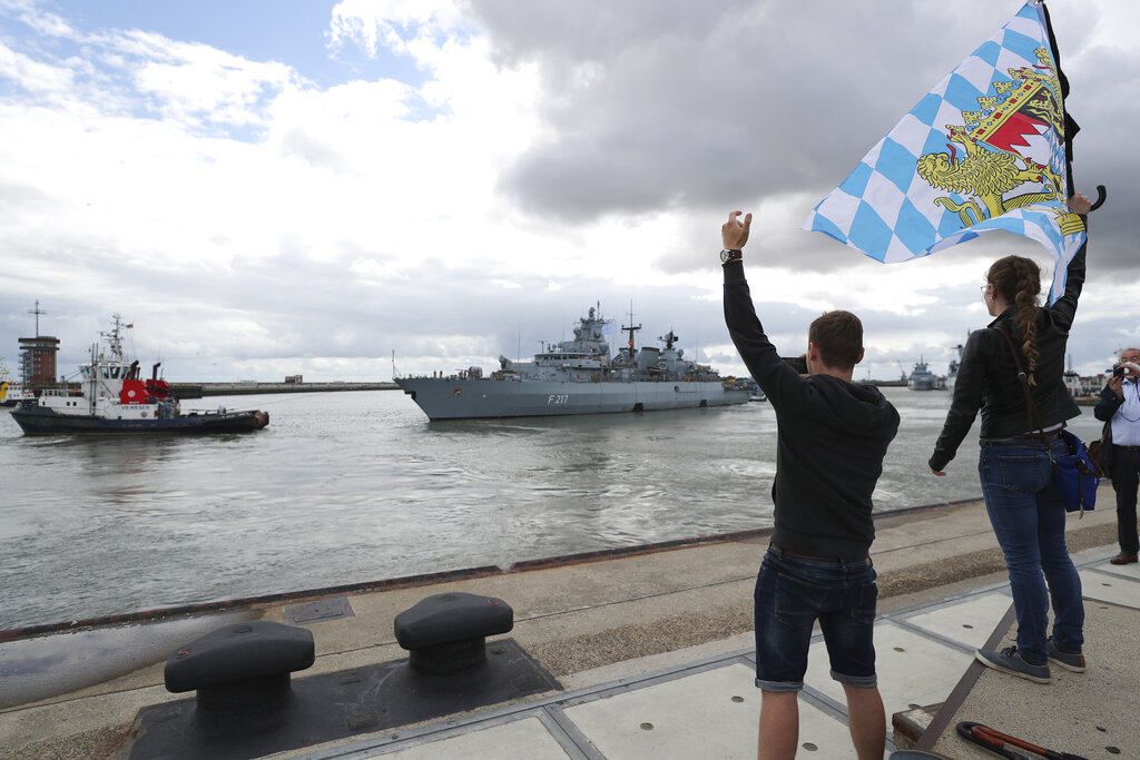 Well-wishers wave as Germany's naval frigate Bayern leaves the port of Wilhelmshaven, Germany, Aug. 2, 2021. Heading for the Indo-Pacific region, the crew will be underway for more than six months.