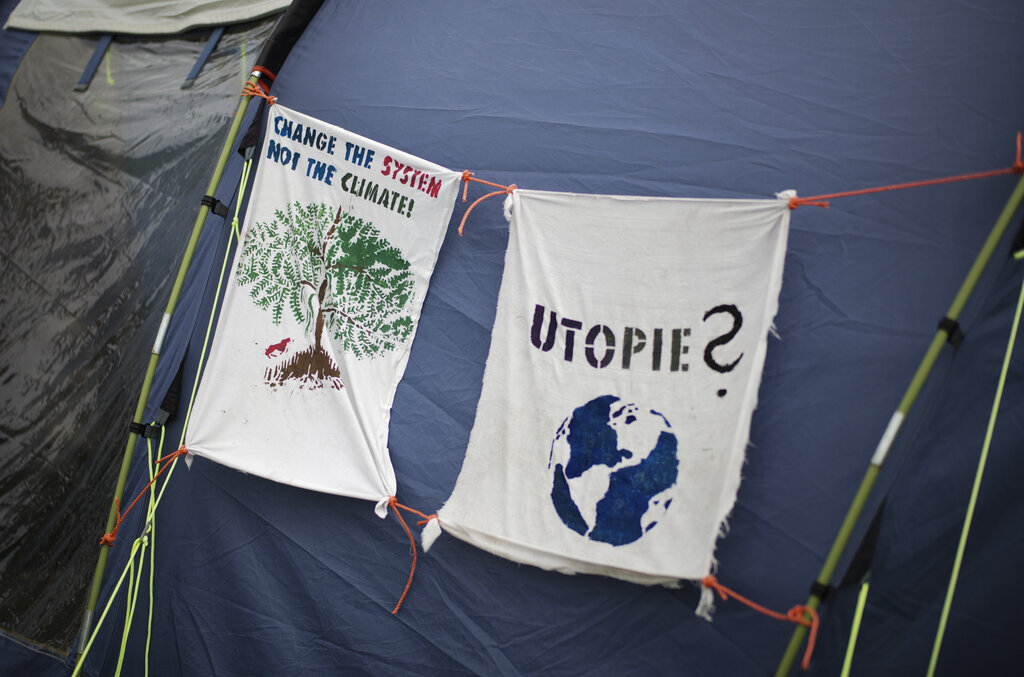 A tent is decorated with banners demanding to change the climate policy in a small camp where climate activists on a hunger strike near the chancellery in Berlin, Wednesday, Sept. 22, 2021. With the hunger strike the climate activists hope to pressure candidates for chancellor of Germany into meeting them for a debate about the climate crisis ahead Sunday's general election. For the first time in Germany's history, climate change is a central issue of an election campaign, overwhelmingly so for the young generation.