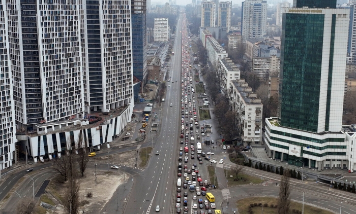 Civil defense sirens wailed in the air of the capital, Kyiv, in the gray and drizzly morning, but the city's main street Khreshchatyk was a mixture of anxiety and normalcy.