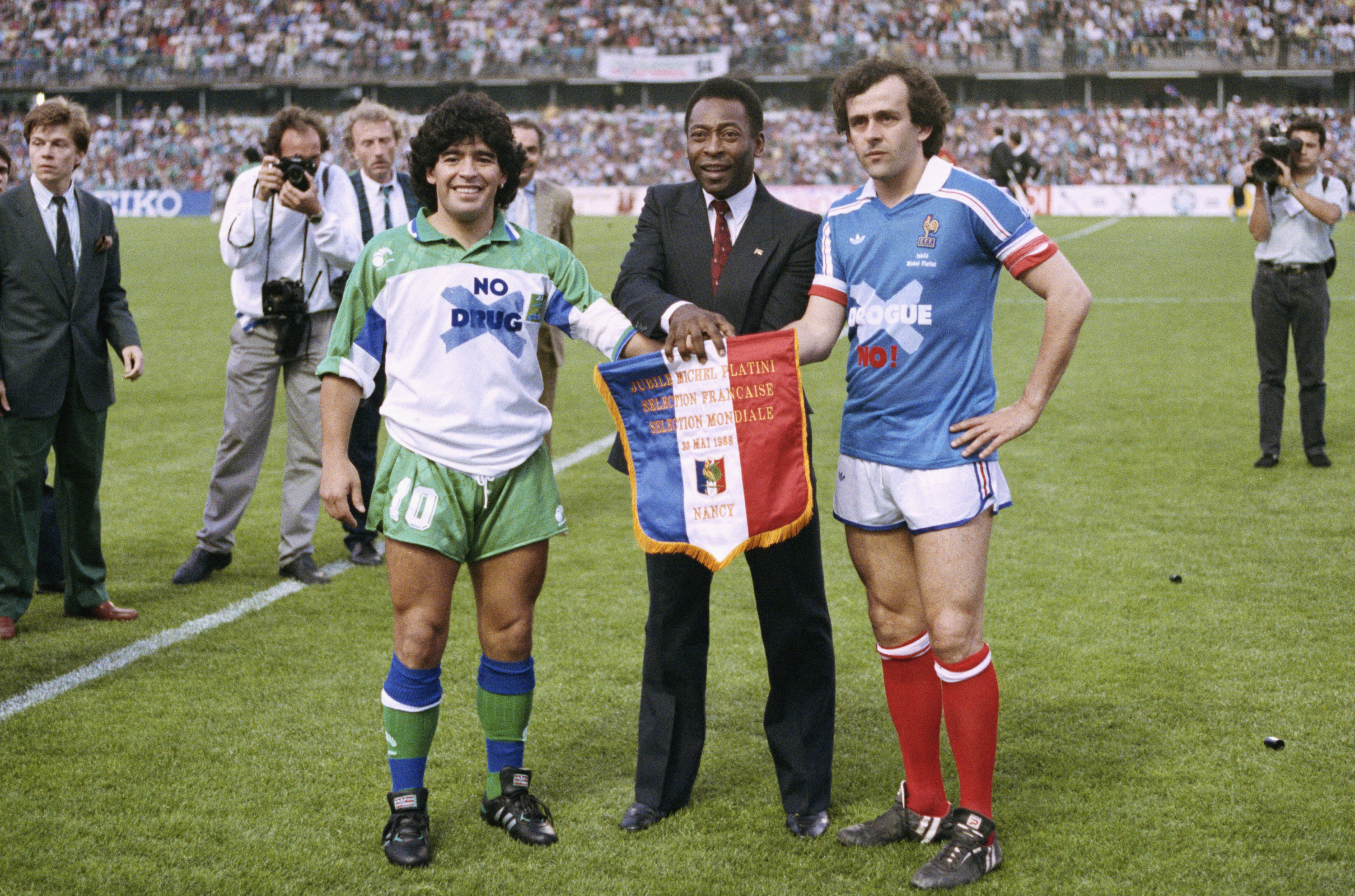 In this May 23, 1998 file photo, soccer stars Argentina's Diego Maradona, left, Pele of Brazil, center, and France's Michel Platini pose shaking hands during Platini's jubilee at Nancy stadium, eastern France.