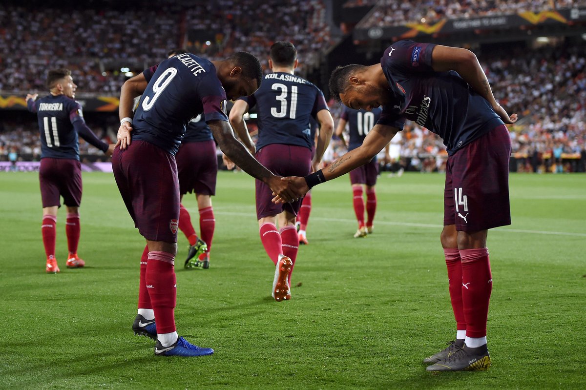 Arsenal's Pierre-Emerick Aubameyang and Alexandre Lacazette celebrate after scoring a goal.