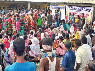 children and pregnant woman in shelter camps in flood ravaged assam