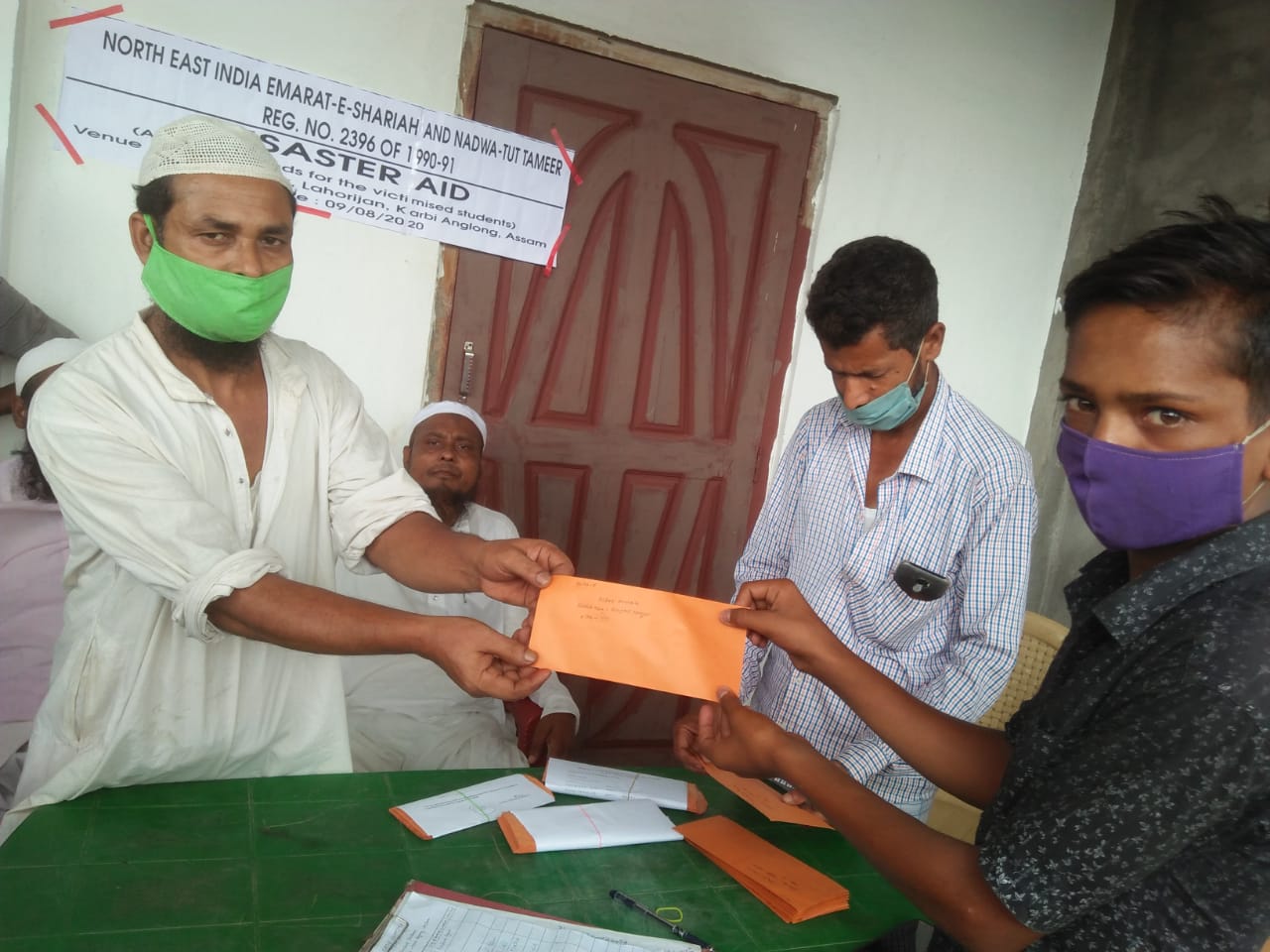 Diphu north- east nadwat ut tamir donate cash to fire victim students at lahorijan