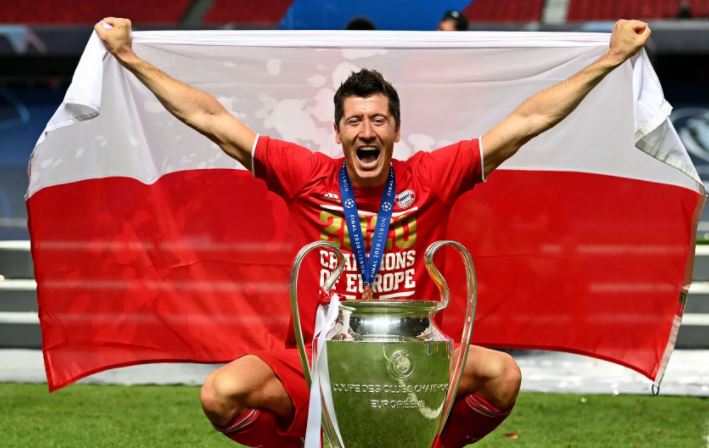 Robert Lewandowski of Poland poses for a photo with UCL trophy.