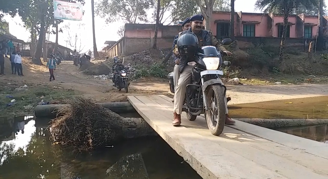 Bridge Supported by Wooden and Electric Poles