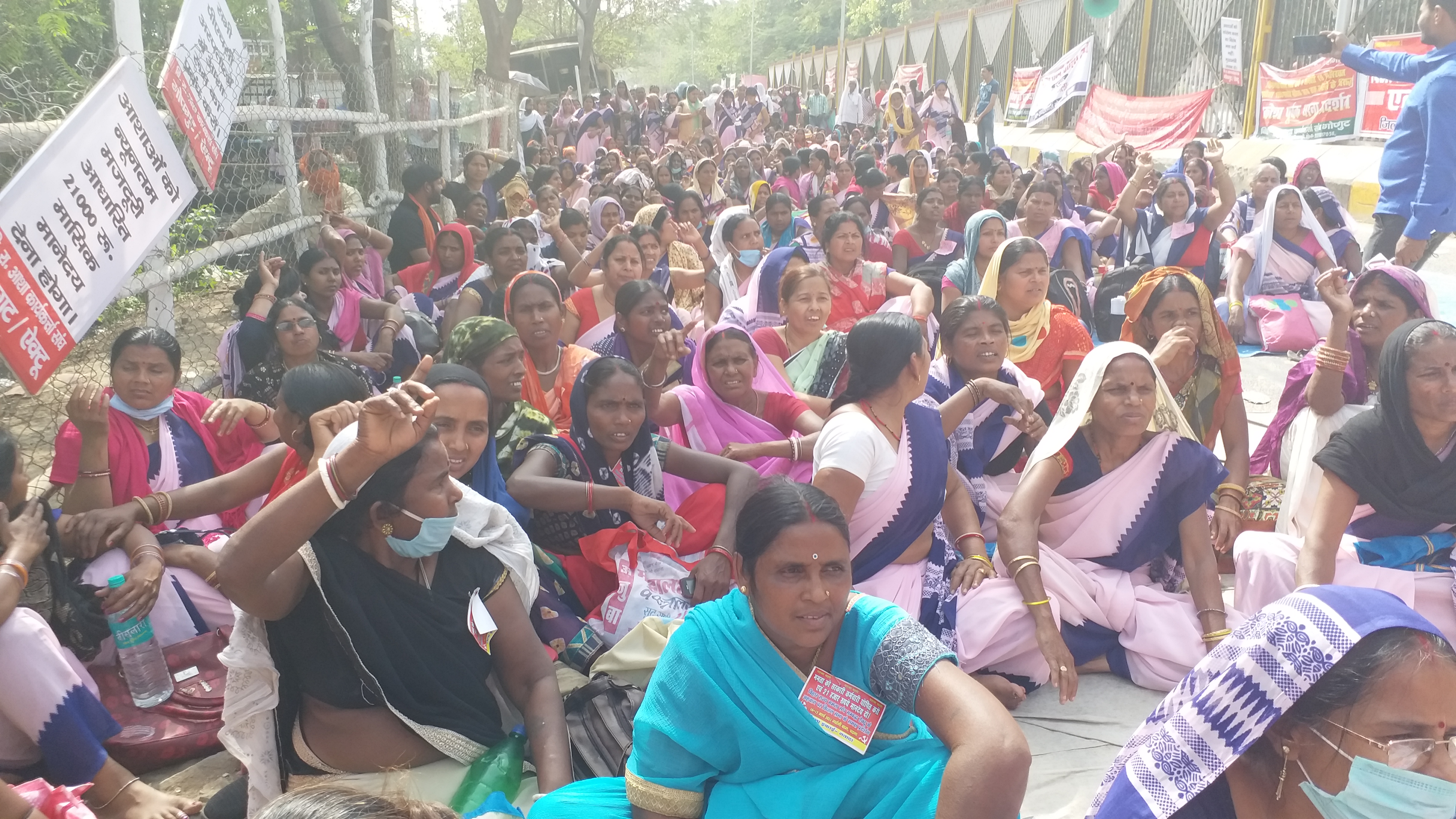 ASHA workers sitting on strike.