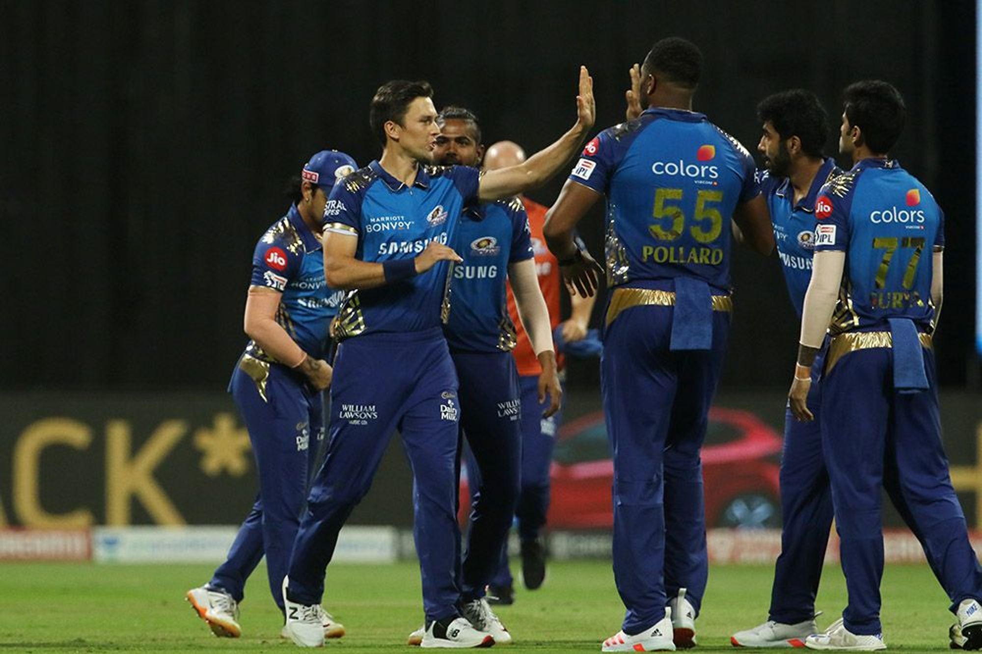 Trent Boult and MI players celebrate after dismissing Chris Morris.