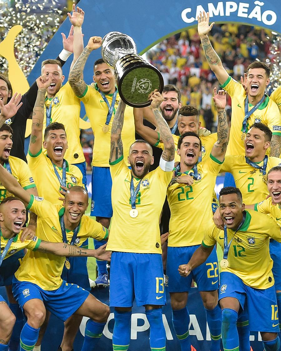 Brazil captain Dani Alves lifts the Copa America title.