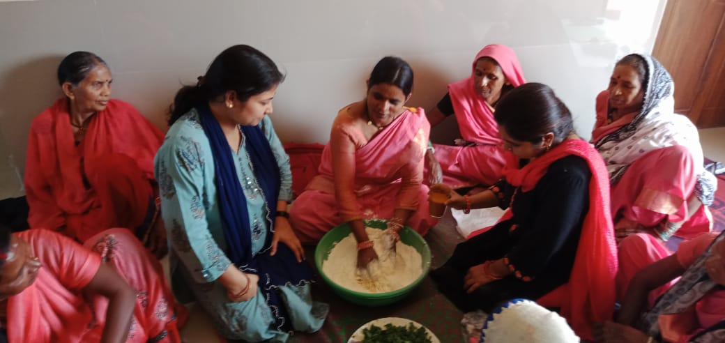 Women making herbal gulal