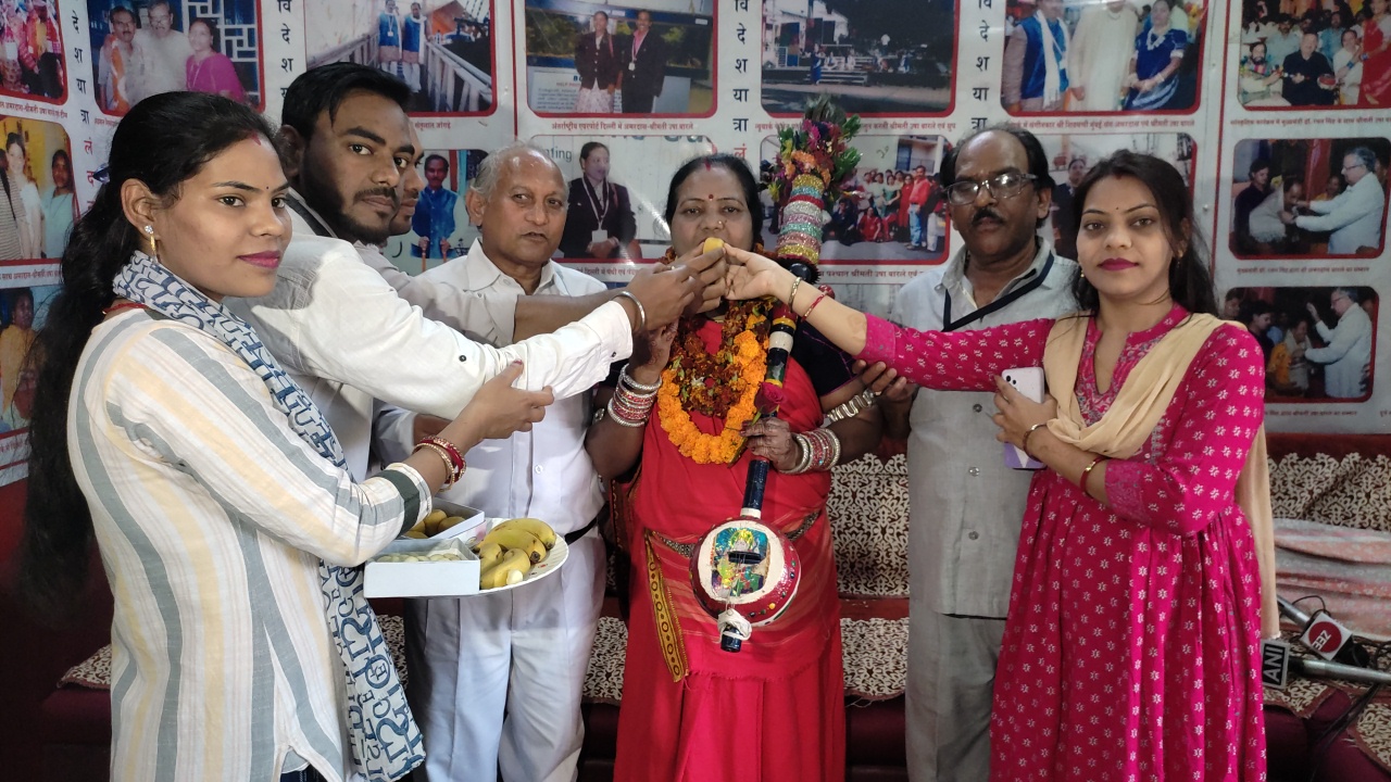 Family members congratulate Usha Barle