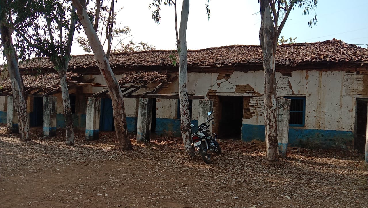 children studying in shabby school building