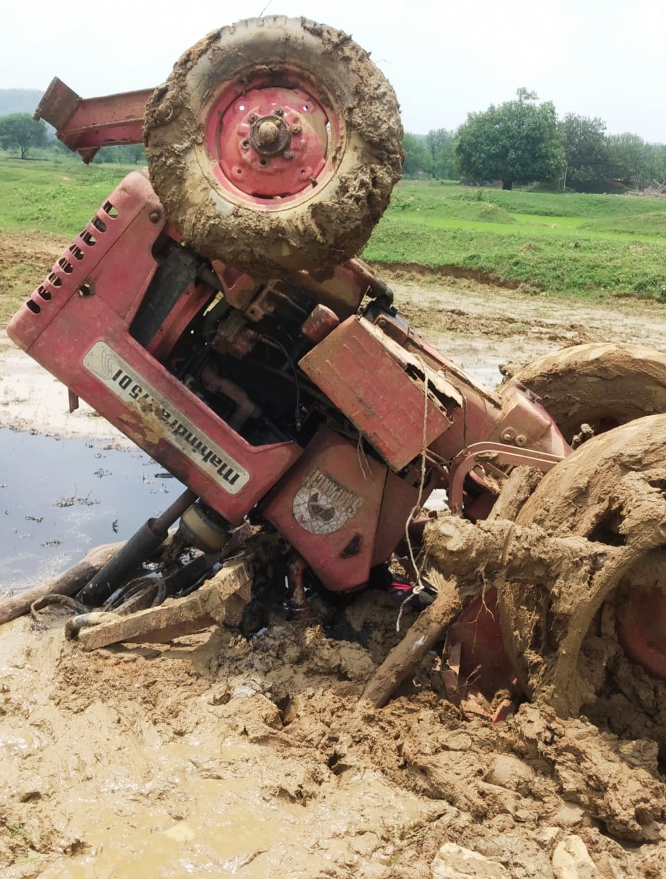 death in field due to tractor overturned