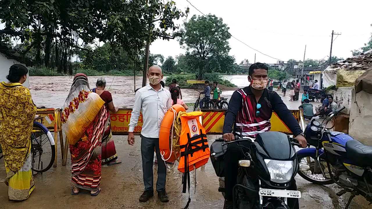 Divers stationed along the river