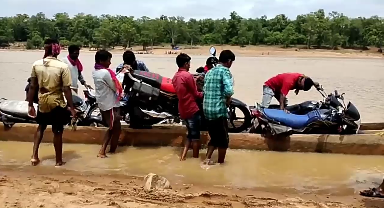 villagers crossing the river by boat