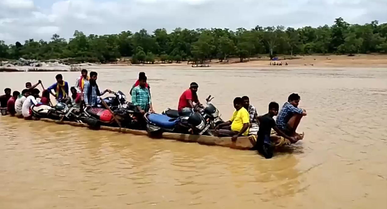 villagers crossing the river by boat