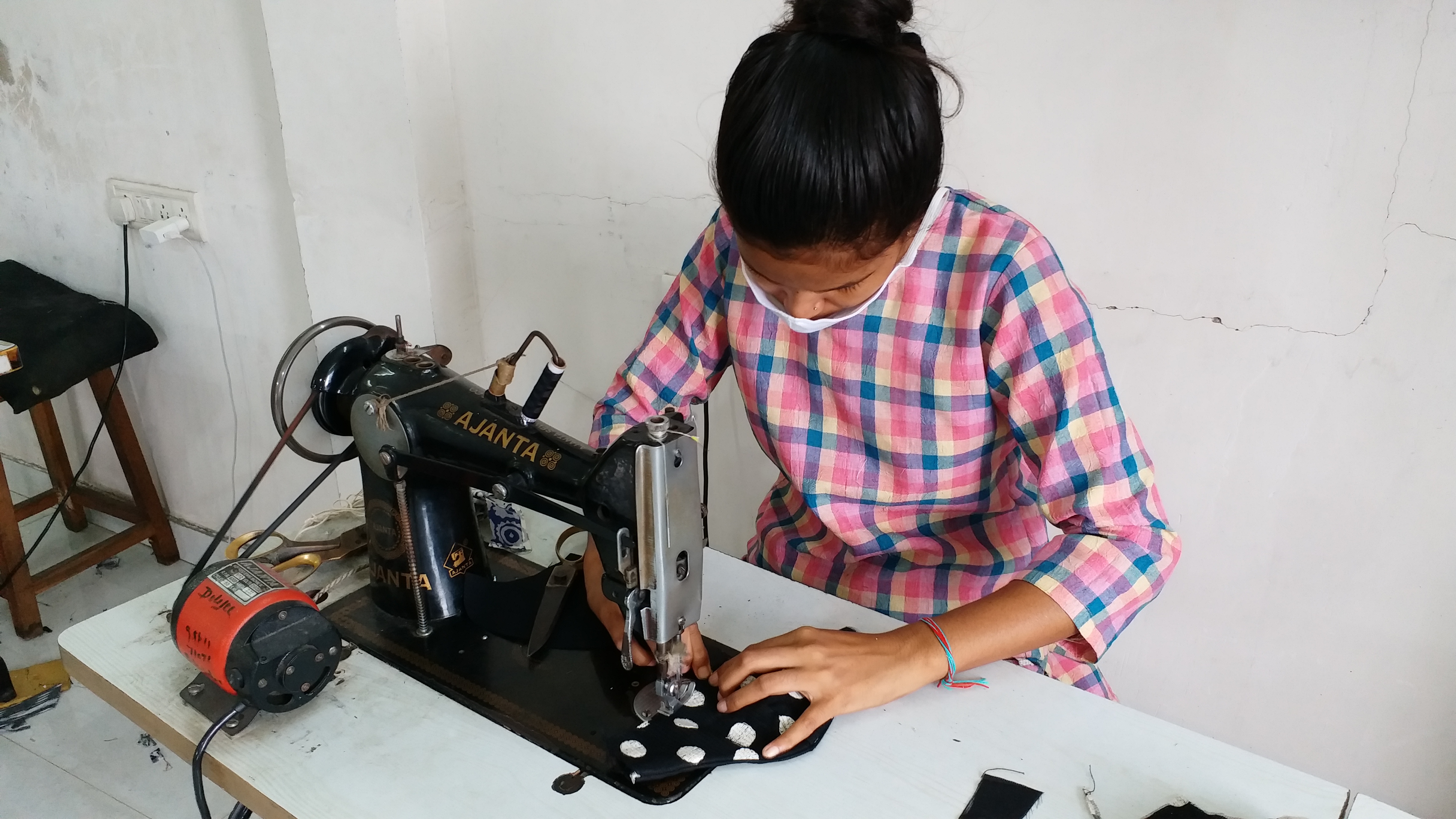 A woman making a mask